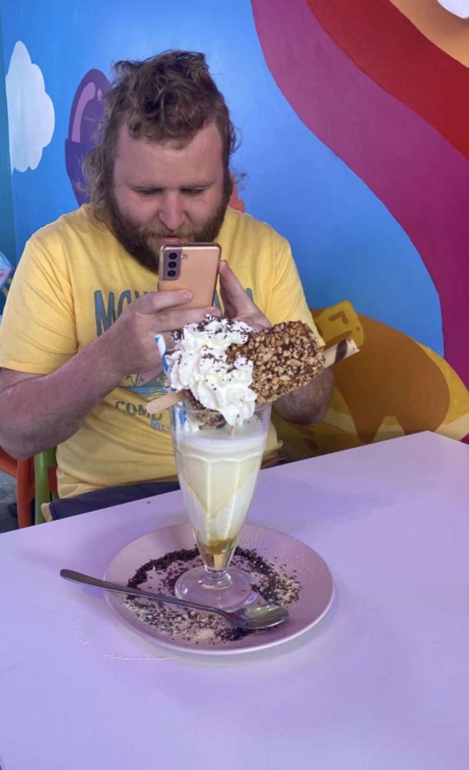Photographing an impressive ice cream sundae at a colourful cafe