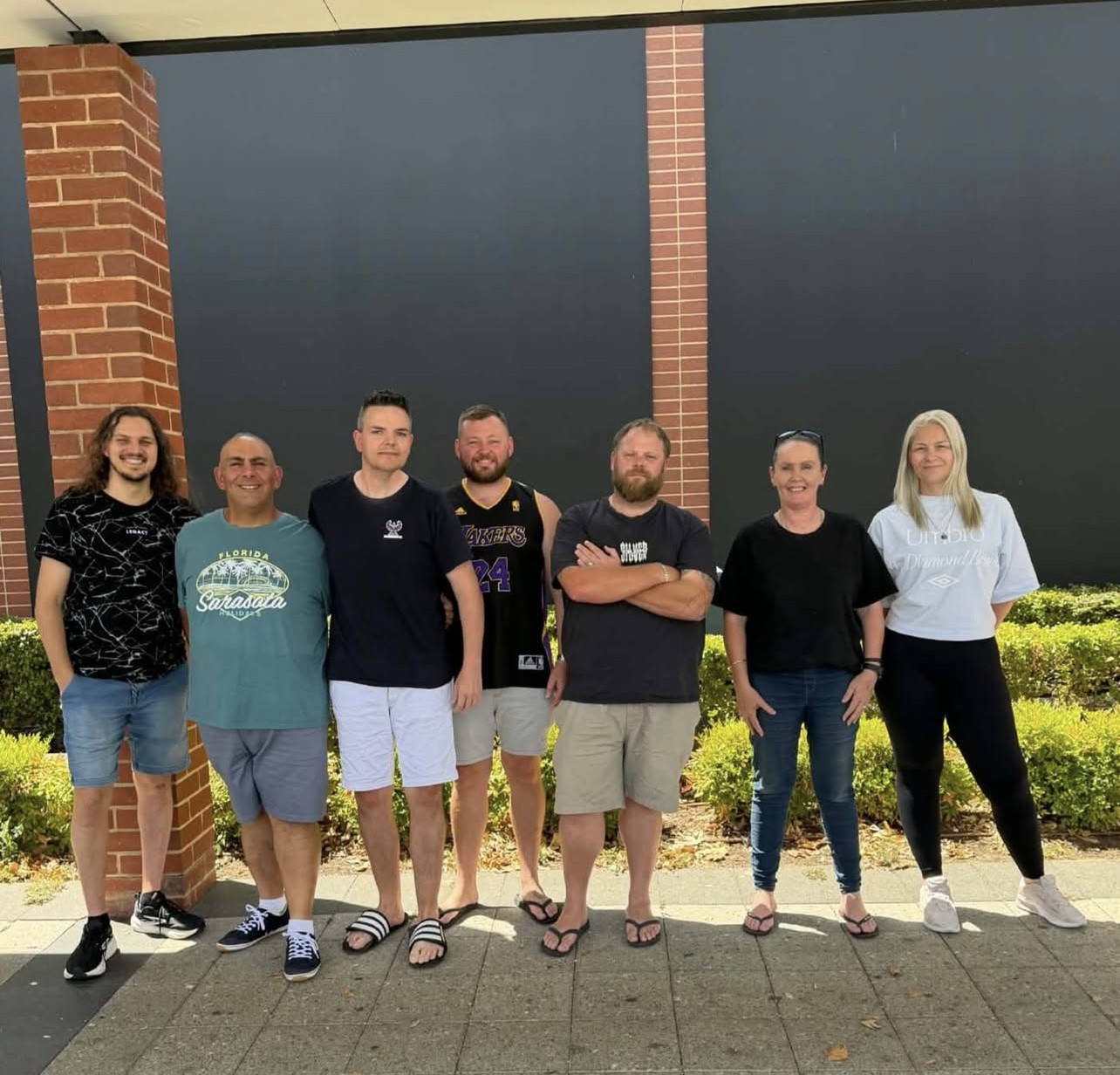The Equilibrium SA team gathered together outdoors, smiling and relaxed